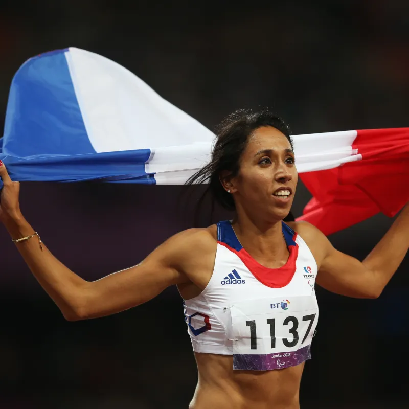 LONDON, ENGLAND - SEPTEMBER 04:  Assia El Hannouni of France wins gold in the Women's 400m - T12 Final on day 6 of the London 2012 Paralympic Games at Olympic Stadium on September 4, 2012 in London, England.  (Photo by Julian Finney/Getty Images)